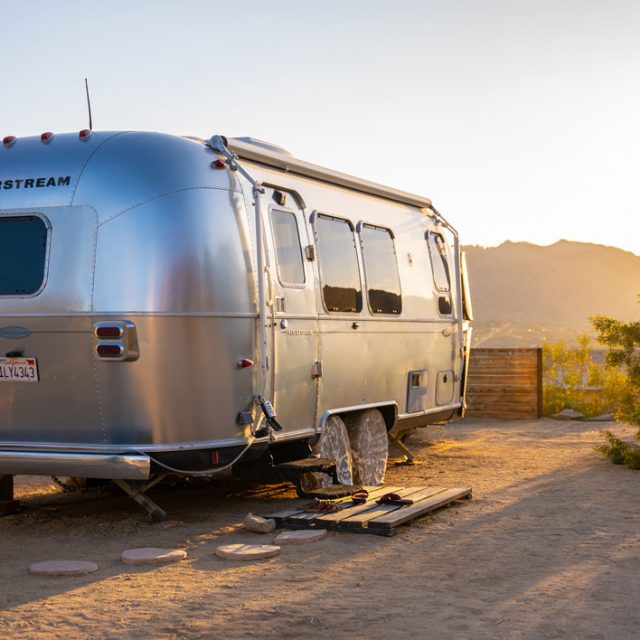 airstream camper parked with a mountain view