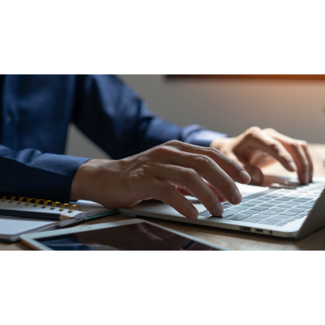 person typing on computer