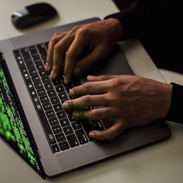 hacker attempting to gain access to a laptop computer